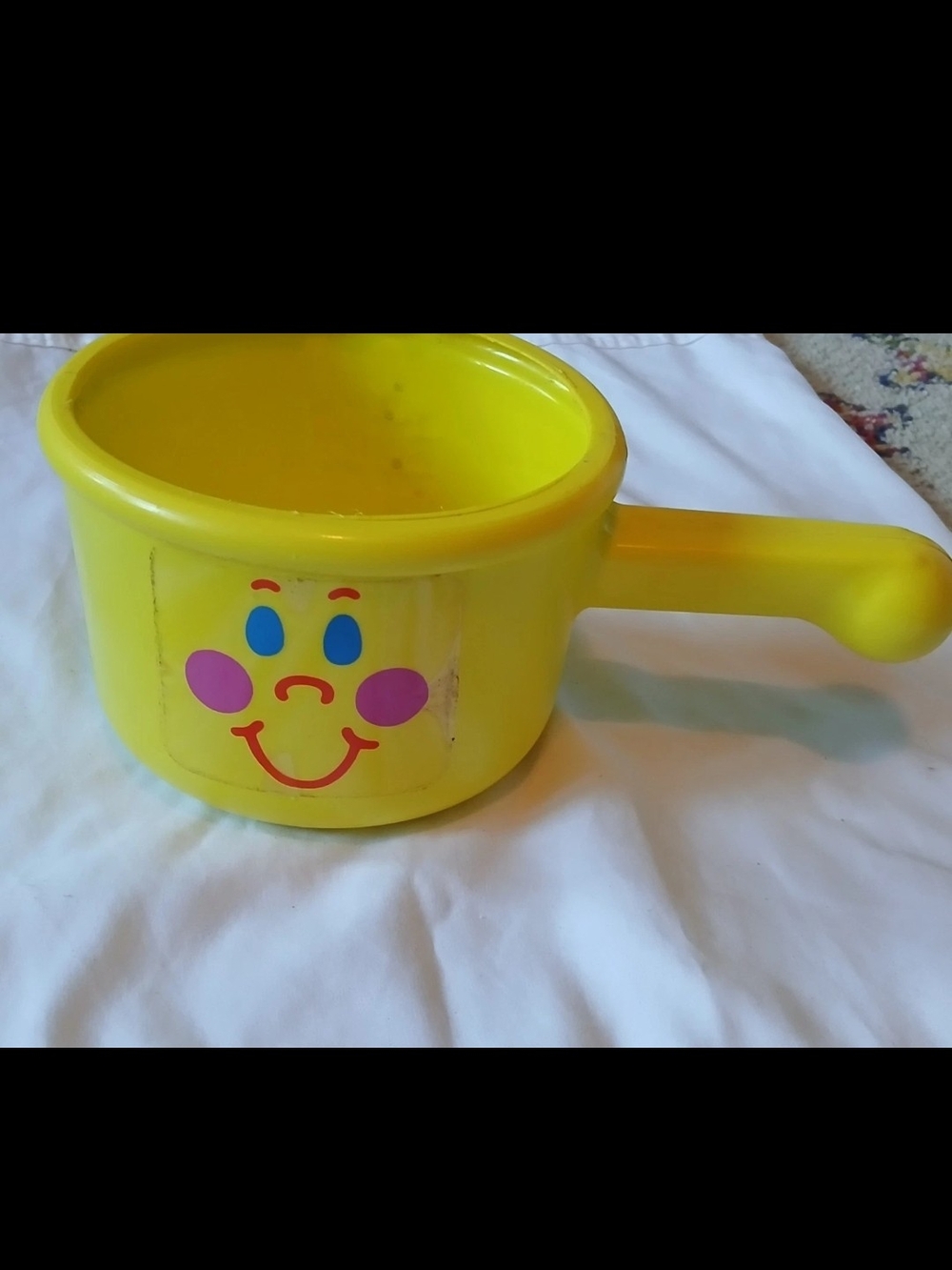 The First Years Yellow Smiley Toy Cooking Pot with Handle for Ages 12-18 Months